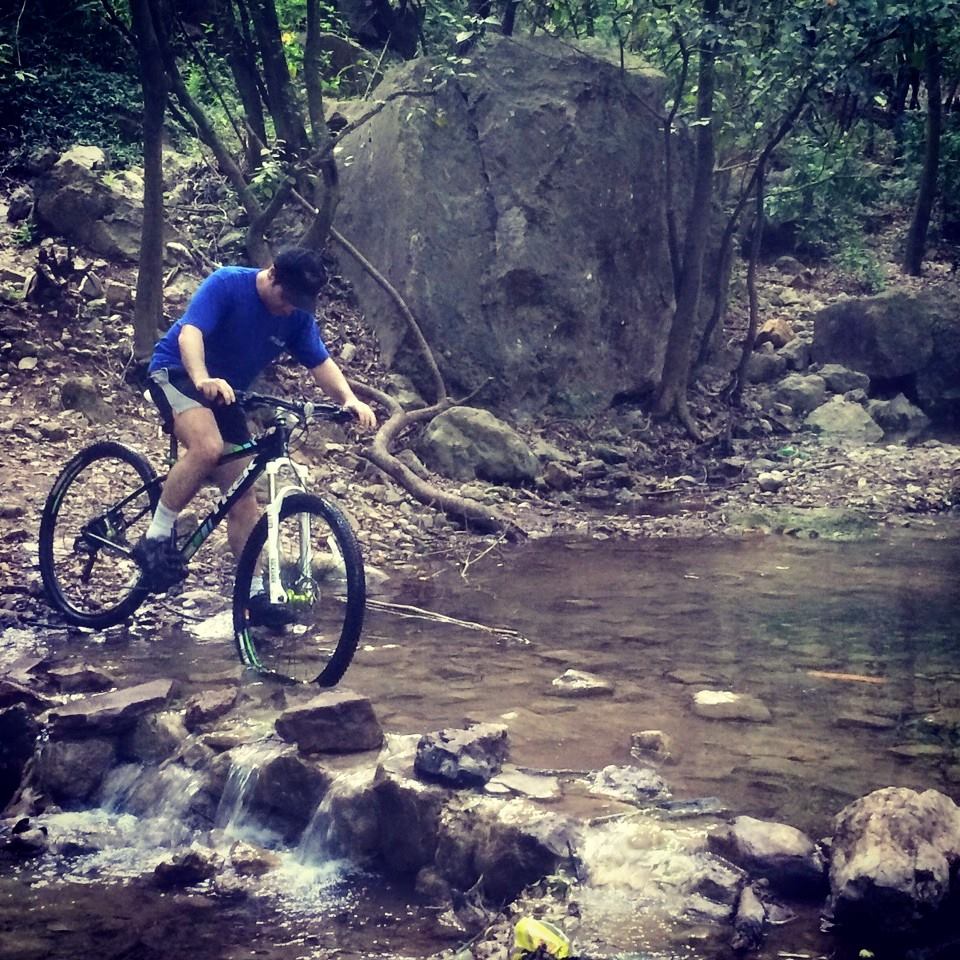 6 - Haroon Crossing a stream while cycling in the beautiful trails of Margalla Hills
