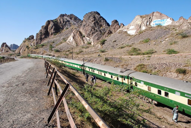 10 - Train passing through the mountainous ridge near Railway Bridge at Chenab near Chiniot