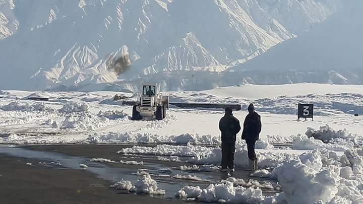 14 - Snow being removed from the runway of the Skardu Airport during winter